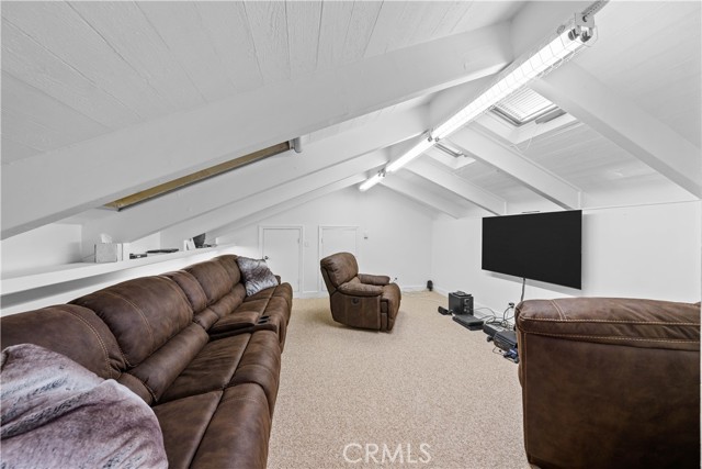 Loft area used for gaming with skylights