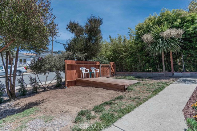 Previous tenants had dogs that destroyed the front yard. They also built some kind of deck and enclosure....this is what is left of it all.