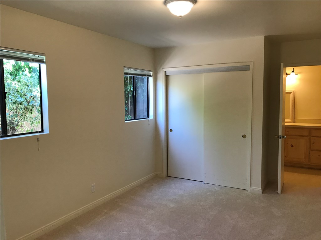 Bedroom #3 with new carpet and access to 1/2 bath