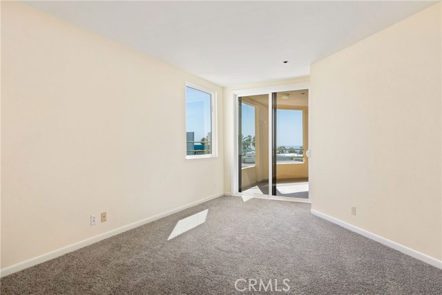 Master bedroom with doors to patio.