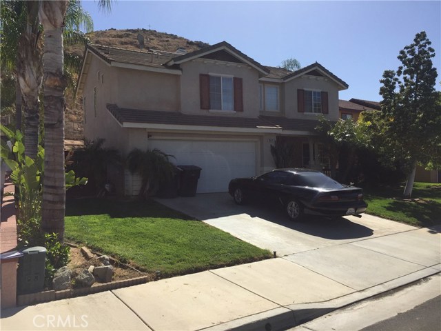 BLOCK WALL HARDSCAPING WITH MATURE PALMS