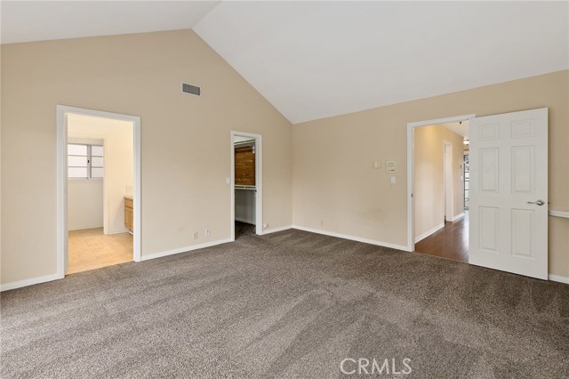 Over sized master bedroom with high vaulted ceilings walk in Ceder lined closet.  Entrance to spa like master bath and a private South facing patio.