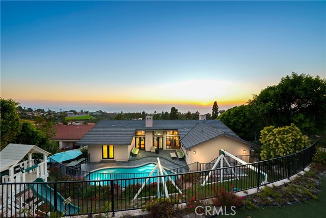 View of back of home from upper back yard area!  Stunning!