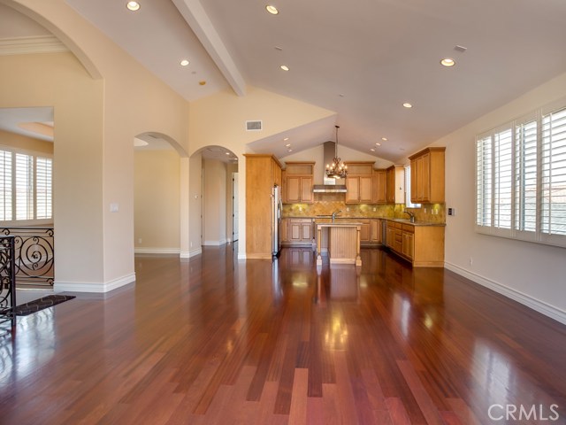 Magnificent open living space with exquisite architectural details such as arches and beamed vaulted ceilings.  Fabulous Brazilian cherry hardwood floors (just sanded and stained) cover the entire second floor (with exception of baths).