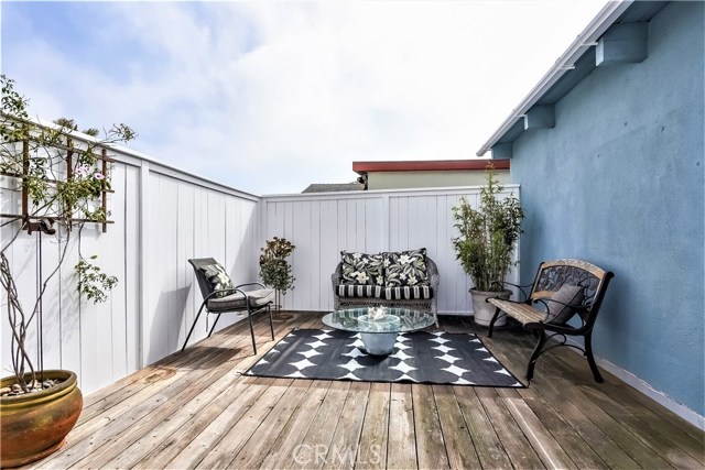 The upper level deck is spacious with tall walls for privacy. This is the perfect area for sunning, relaxing, reading and enjoying warm days and evenings.