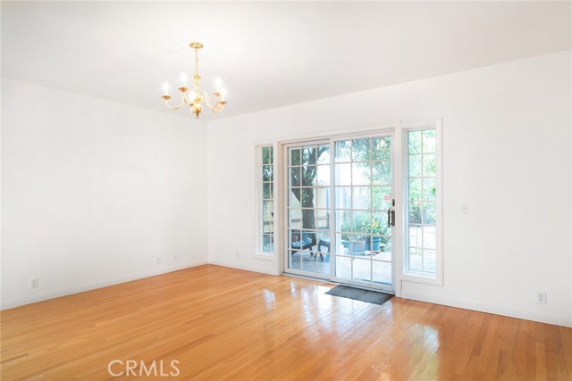 This is the first level family room that is adjacent to kitchen. Sliding door leads to back patio and yard. The light fixture is not idea for a family room. Owners used this as a very large dining room.