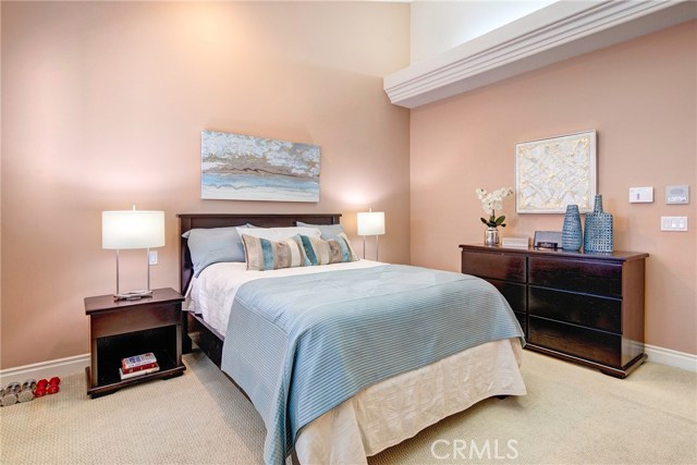 Peaceful and quiet master bedroom suite with vaulted ceilings, ceiling fan, and walk-in closet (not pictured).