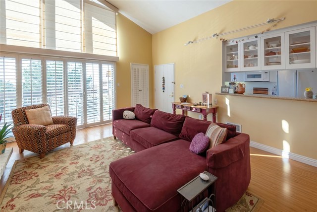 The Living Area features a wall of windows with Plantation shutters and custom window shades (remote controlled).