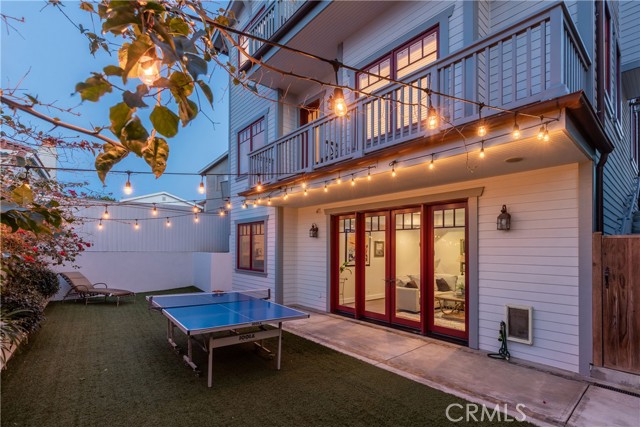 The fun never ends...night-lit rear yard keeps the action alive!