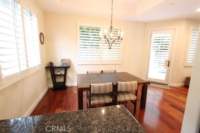Kitchen, dining, eating area with ease of access to rear patio, ideal for backyard lounging or entertaining.