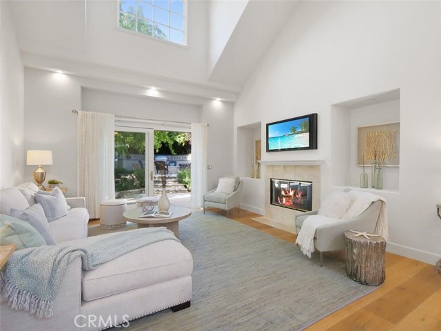 Sliding doors open to the beautiful landscaped backyard