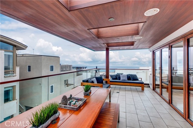 Enjoy panoramic ocean views from two expansive balconies on the upper level