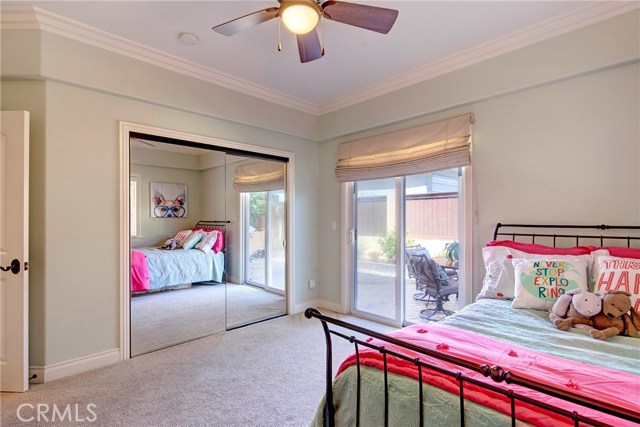 2nd of two large bedrooms downstairs, light and bright, spacious closet, and access to the backyard.