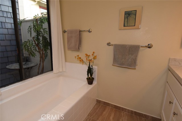 Tub in 2nd master bath area.  Nice view onto the little outdoor sitting area!