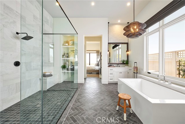 Master suite on the ground floor is simple, elegant and luxurious. Model home shown.