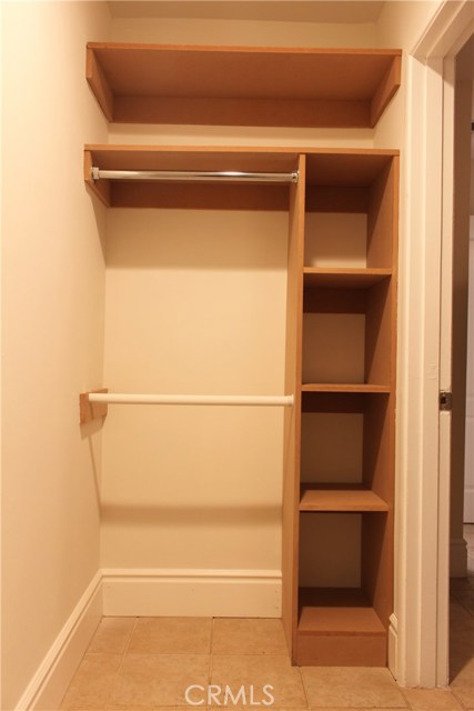 414 A: Shared closet with built-in shelving.