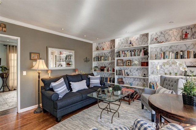 Living room with entry to main floor bedroom, currently utilized as a family room.