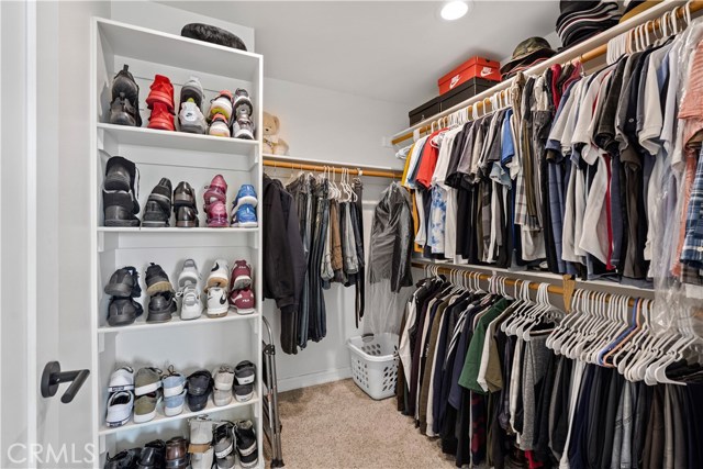 Primary bedroom walk-in closet