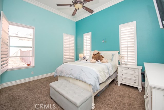 Bedroom #3 with Ceiling Fan and Plantation Shutters.