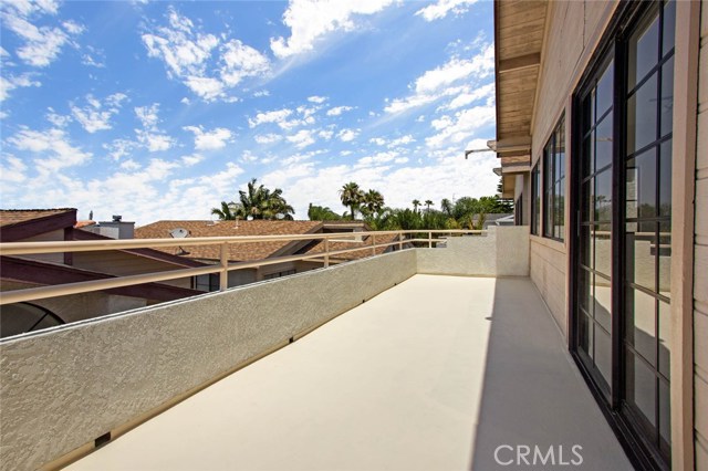 Large ocean view balcony off of family/dining area