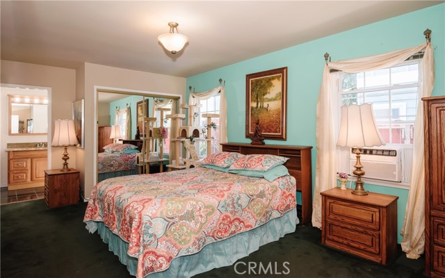 Master Bedroom with carpet, dual closets and private Master Bathroom