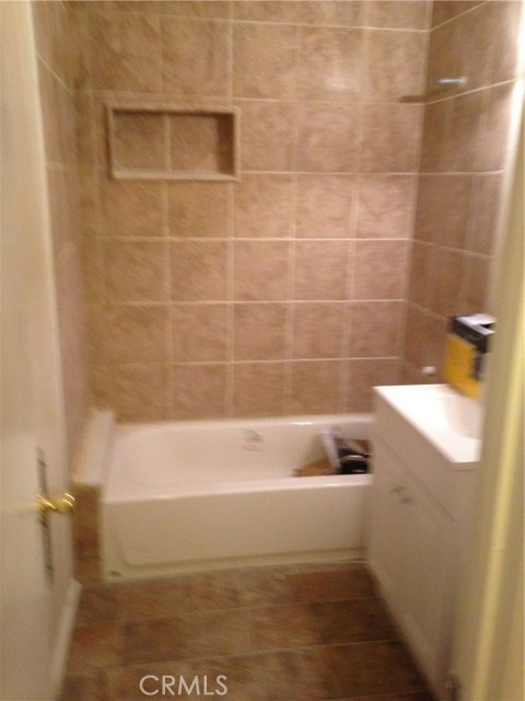 Renovated bath with new tub and tile.