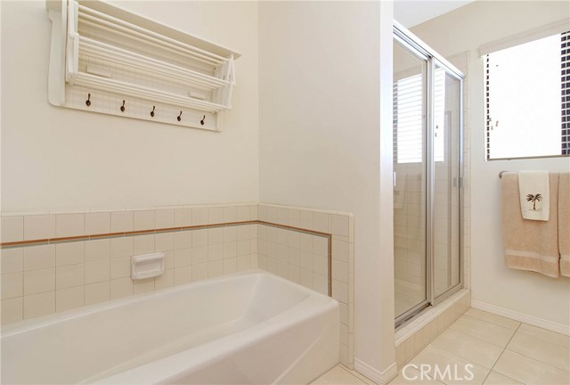 Another view of the hall bathroom with a separate tub and shower.