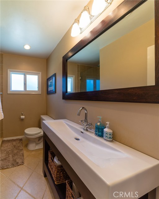 3/4 bath with tile floors.