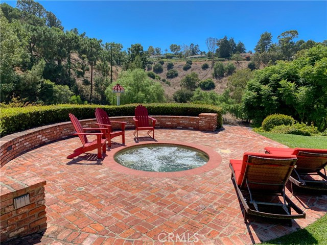 The in ground spa is set apart in the third patio area.