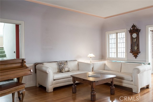 Living Room (Original Home) With Beautiful Coved Ceiling, Unique Stained Glass Windows And Fireplace