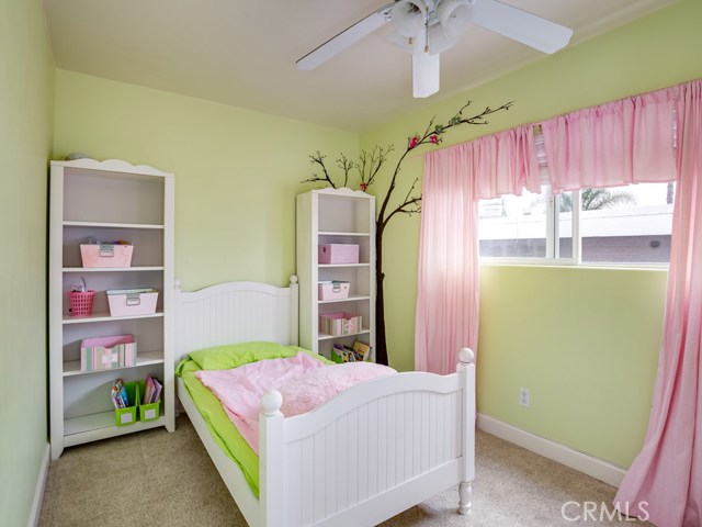 Second bedroom with beautiful painted mural.