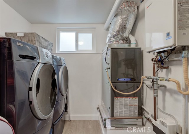 Washer/Dryer included in sale
Note new heating system and tankless water heater. Also room for storage rack to the left of entry. Perfect for cleaning supplies.