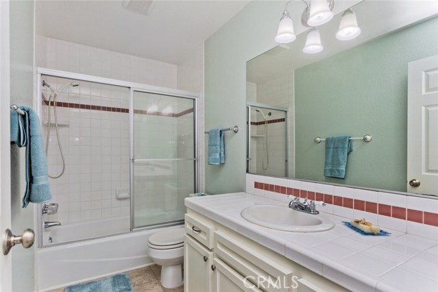 Upper level hallway bathroom with shower/tub and lots of storage.