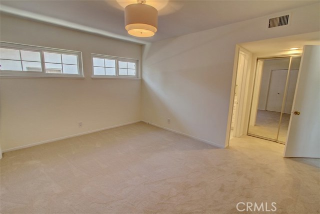 Master bedroom alternate view with mirrored closet