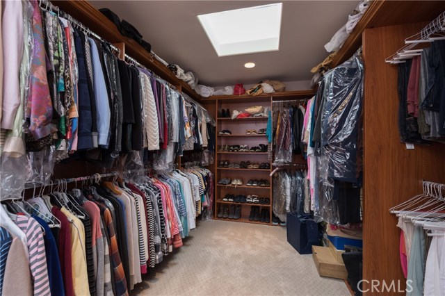 Oversized walk-in master closet with organizers and skylight!