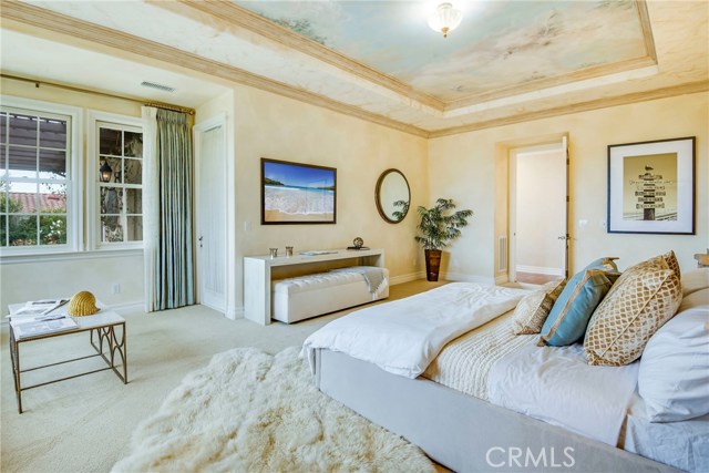 Large Master Bedroom with custom painted ceiling.