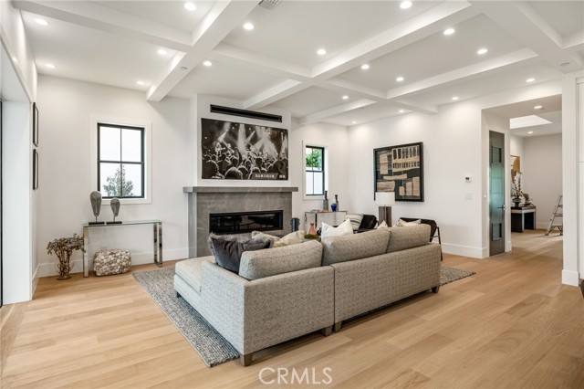 Soaring ceilings, gorgeous wood floors, statement fireplace... no detail overlooked