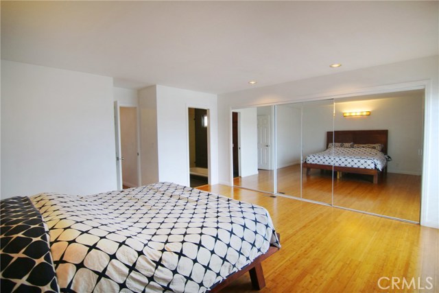 Master with features his and her mirrored closets.