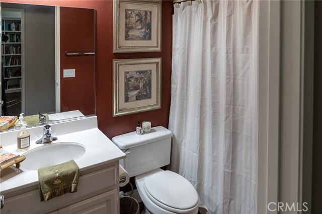 Downstairs full bath with tub and shower.  Right across hall from downstairs bedroom.