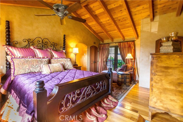 Master Bedroom With Sitting Area And French Doors To Patio