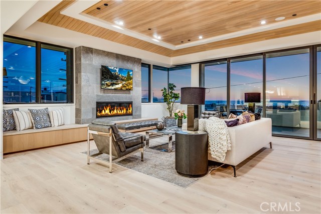 Enjoy cozy fires from the chic fireplace in the living room while you take in expansive ocean views.