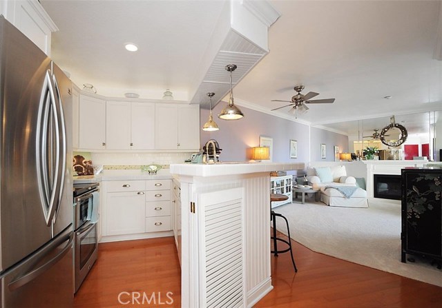 Remodeled Kitchen with Stainless Steel Appliances and Laminate Wood Flooring