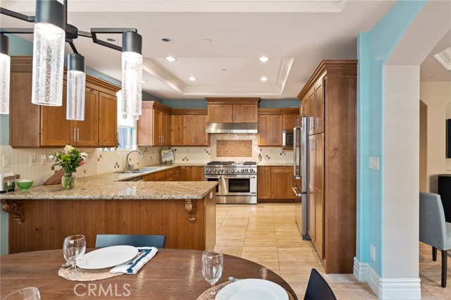 Kitchen opens to dining room