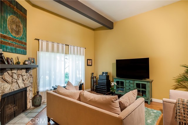 Bright Living Room with corner fireplace.