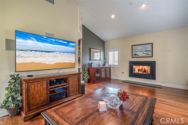 Lots of room to entertain your guests in this lovely family room with bar and fireplace!
