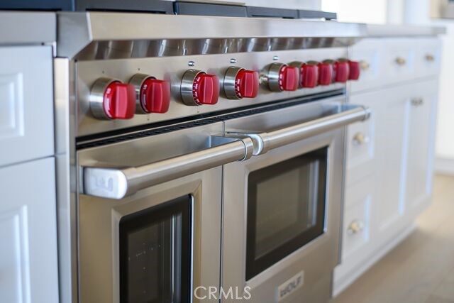 Wolf range with double oven part of the gourmet kitchen.