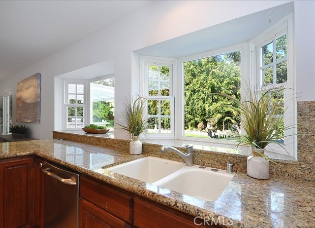 Enjoy washing dishes while viewing the beautiful back yard.