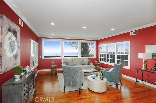 Gleaming hardwood floors, and view windows on three sides of the inviting Living Room.