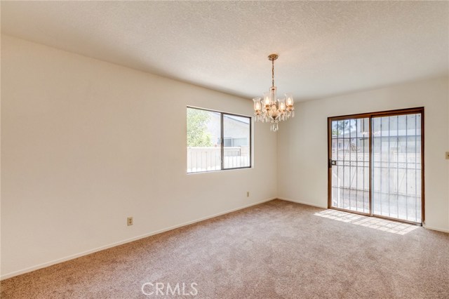 Spacious dining room with access to backyard is perfect for entertaining.