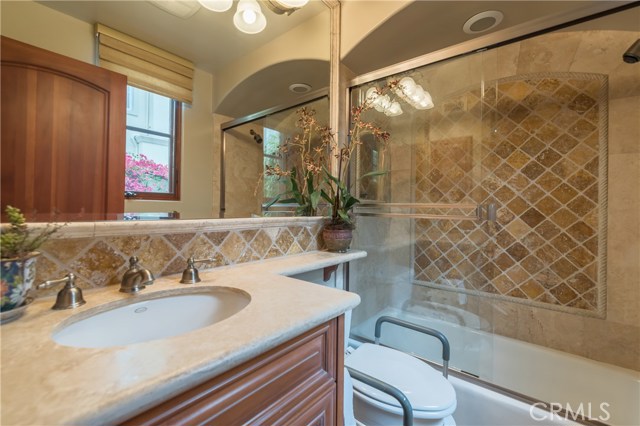 Full bath attached to downstairs Bedroom #5.